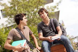 bigstock-two-young-student-talking-at-t-15474467